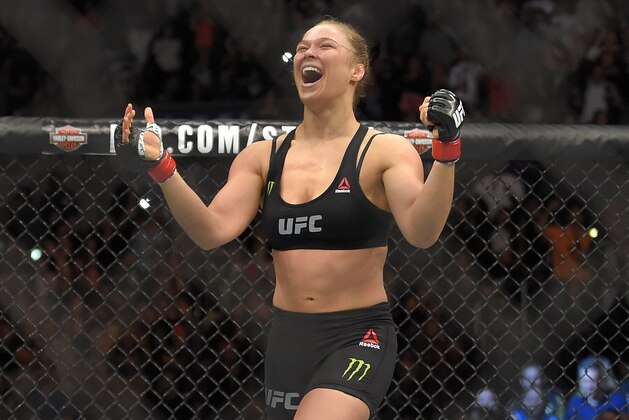 Ronda Rousey, celebrates after defeating Cat Zingano in a UFC 184 mixed martial arts bantamweight title bout, Saturday, Feb. 28, 2015, in Los Angeles. Rousey won after Zingano tapped out 14 seconds into the bout. (AP Photo/Mark J. Terrill)