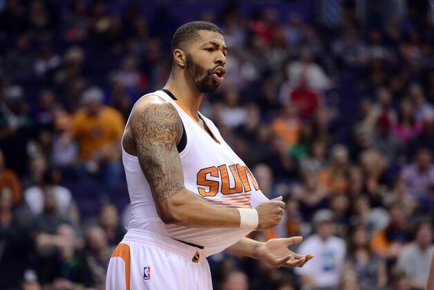 Feb 28, 2015; Phoenix, AZ, USA; Phoenix Suns forward Markieff Morris (11) reacts against the San Antonio Spurs during the first half at US Airways Center. Mandatory Credit: Joe Camporeale-USA TODAY Sports
