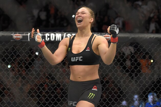 Ronda Rousey, celebrates after defeating Cat Zingano in a UFC 184 mixed martial arts bantamweight title bout, Saturday, Feb. 28, 2015, in Los Angeles. Rousey won after Zingano tapped out 14 seconds into the bout. (AP Photo/Mark J. Terrill)