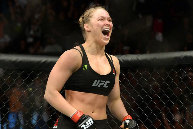 Feb 28, 2015; Los Angeles, CA, USA; Ronda Rousey (red gloves) reacts after defeating Cat Zingano (not pictured) during their women's bantamweight title bout at UFC 184 at Staples Center. Rousey won in 14 seconds of the first round. Mandatory Credit: Jayne Kamin-Oncea-USA TODAY Sports
