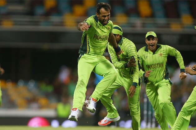 BRISBANE, AUSTRALIA - MARCH 01:  Wahab Riaz of Pakistan celebrates with team mates after taking the wicket of Tewanda Mupariwa of Zimbabwe during the 2015 ICC Cricket World Cup match between Pakistan and Zimbabwe at The Gabba on March 1, 2015 in Brisbane, Australia.  (Photo by Chris Hyde/Getty Images)