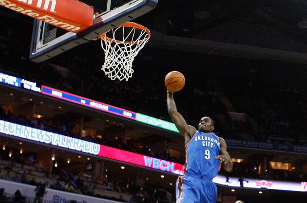 CHARLOTTE, NC - DECEMBER 21:  Serge Ibaka #9 of the Oklahoma Thunder is fouled by D.J. Augustin #14 of the Charlotte Bobcats during their game at Time Warner Cable Arena on December 21, 2010 in Charlotte, North Carolina. NOTE TO USER: User expressly acknowledges and agrees that, by downloading and/or using this Photograph, User is consenting to the terms and conditions of the Getty Images License Agreement.  (Photo by Streeter Lecka/Getty Images)