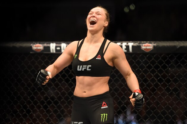 LOS ANGELES, CA - FEBRUARY 28:  Ronda Rousey celebrates her victory over Cat Zingano in their UFC women's bantamweight championship bout during the UFC 184 event at Staples Center on February 28, 2015 in Los Angeles, California.  (Photo by Harry How/Getty Images)
