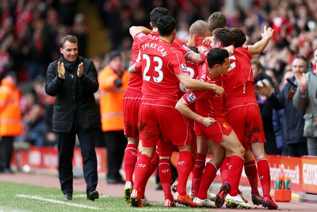 LIVERPOOL, ENGLAND - MARCH 01:  Jordan Henderson (obscured) of Liverpool celebrates with teammates after scoring the opening goal during the Barclays Premier League match between Liverpool and Manchester City at Anfield on March 1, 2015 in Liverpool, England.  (Photo by Clive Brunskill/Getty Images)