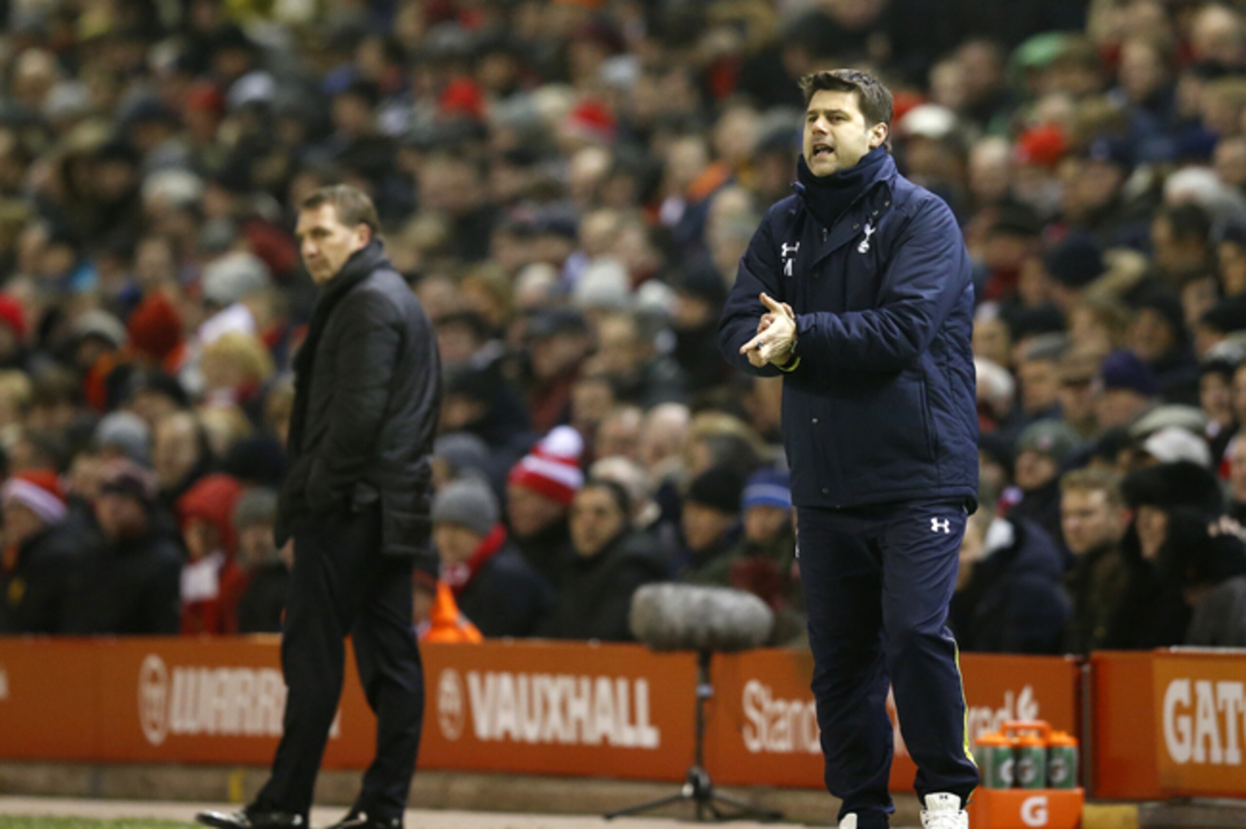 Tottenham manager Mauricio Pochettino shouts to his team as Liverpool manager Brendan Rodgers, left, looks on during the English Premier League soccer match between Liverpool and Tottenham Hotspur at Anfield Stadium, Liverpool, England, Tuesday Feb. 10, 2015. (AP Photo/Jon Super) Tottenham manager Mauricio Pochettino shouts to his team as Liverpool manager Brendan Rodgers, left, looks on during the English Premier League soccer match between Liverpool and Tottenham Hotspur at Anfield Stadium, Liverpool, England, Tuesday Feb. 10, 2015. (AP Photo/Jon Super)