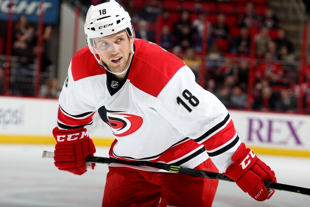 RALEIGH, NC - DECEMBER 02: Jay McClement #18 of the Carolina Hurricanes prepares for a faceoff during their NHL game against the Nashville Predators at PNC Arena on December 2, 2014 in Raleigh, North Carolina.  (Photo by Gregg Forwerck/NHLI via Getty Images)