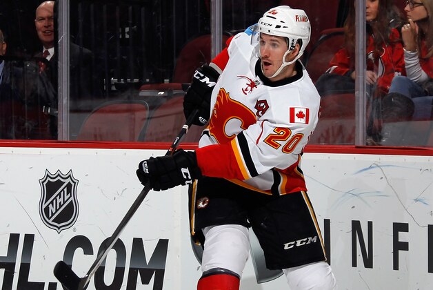 NEWARK, NJ - FEBRUARY 25: Curtis Glencross #20 of the Calgary Flames skates again the New Jersey Devils at the Prudential Center on February 25, 2015 in Newark, New Jersey.  (Photo by Bruce Bennett/Getty Images)