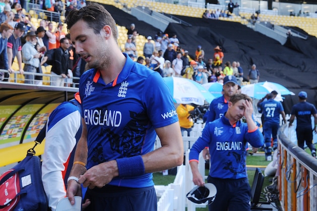 England's Steven Finn, left, and teammate James Taylor leave the field after their nine wicket loss to Sri Lanka in their Cricket World Cup match in Wellington, New Zealand, Sunday, March 1, 2015. (AP Photo Ross Setford)