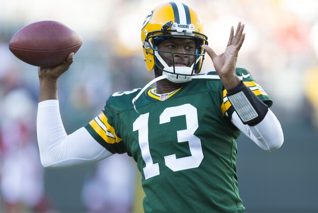 Aug 9, 2013; Green Bay, WI, USA; Green Bay Packers quarterback Vince Young (13) throws a pass during warmups prior to the game against the Arizona Cardinals at Lambeau Field. Mandatory Credit: Jeff Hanisch-USA TODAY Sports