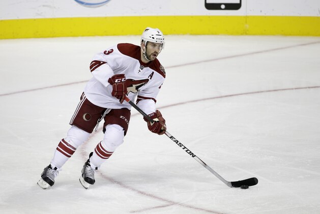 Arizona Coyotes defenseman Keith Yandle (3) controls the puck during an NHL hockey game against the Dallas Stars, Thursday, Nov. 20, 2014, in Dallas. (AP Photo/Tony Gutierrez)