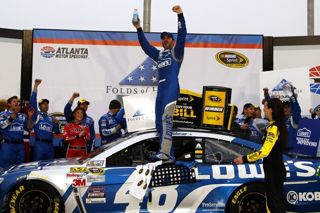 HAMPTON, GA - MARCH 01:  Jimmie Johnson, driver of the #48 Lowe's Chevrolet, celebrates in victory lane after winning the NASCAR Sprint Cup Series Folds of Honor QuikTrip 500 at Atlanta Motor Speedway on March 1, 2015 in Hampton, Georgia.  (Photo by Jerry Markland/Getty Images)