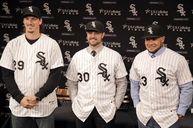 Pitchers Jeff Samardzija, left, and David Robertson are joined by free-agent outfielder Melky Cabrera, right, while being introduced as the newest Chicago White Sox at a baseball news conference Tuesday, Dec. 16, 2014, in Chicago. The Sox have been one of the majors' most active teams this offseason. (AP Photo/M. Spencer Green)