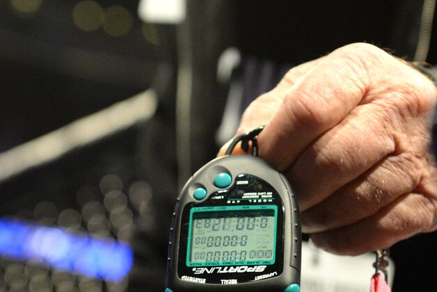 Feb 28, 2015; Los Angeles, CA, USA; UFC rainer Gene LeBell holds a stop watch showing, 12:83 seconds as his time for Ronda Rousey to defeat Cat Zingano (not pictured) at UFC 184 at Staples Center. Mandatory Credit: Jayne Kamin-Oncea-USA TODAY Sports