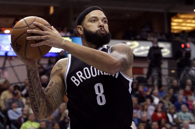 Brooklyn Nets guard Deron Williams (8) looks to pass before landing out of bounds against Dallas Mavericks forward Charlie Villanueva (3) during the first half of an NBA Basketball game Saturday, Feb. 28, 2015, in Dallas. (AP Photo/LM Otero)