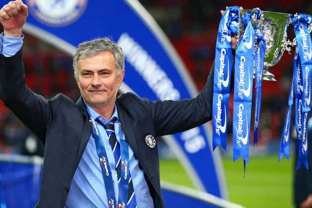 LONDON, ENGLAND - MARCH 01:  Manager Jose Mourinho of Chelsea poses with the trophy during the Capital One Cup Final match between Chelsea and Tottenham Hotspur at Wembley Stadium on March 1, 2015 in London, England.  (Photo by Clive Mason/Getty Images)