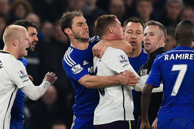 LONDON, ENGLAND - FEBRUARY 11:  Referee Jonathan Moss looks on as Branislav Ivanovic of Chelsea clashes with James McCarthy of Everton during the Barclays Premier League match between Chelsea and Everton at Stamford Bridge on February 11, 2015 in London, England.  (Photo by Mike Hewitt/Getty Images)