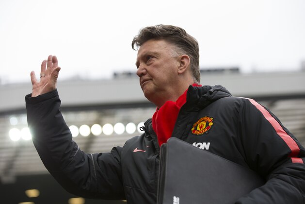 Manchester United's manager Louis van Gaal waves as he takes to the touchline before his team's English Premier League soccer match between Manchester United and Sunderland at Old Trafford Stadium, Manchester, England, Saturday Feb. 28, 2015. (AP Photo/Jon Super)