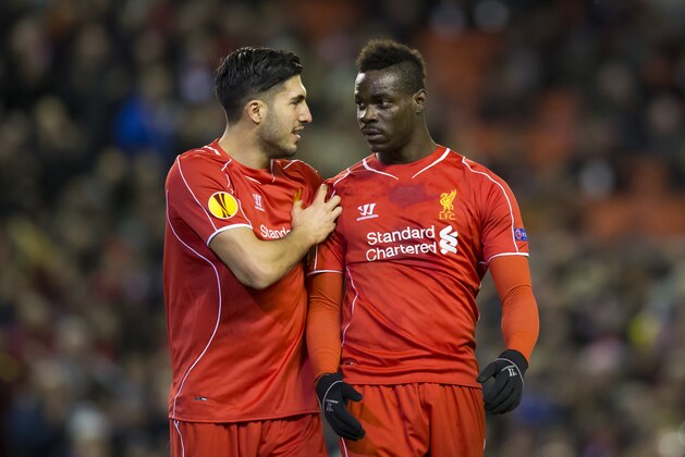 Liverpool's Mario Balotelli, right, celebrates with teammate Emre Can after scoring a penalty during the Europa League Round of 32 soccer match between Liverpool and Besiktas at Anfield Stadium in Liverpool, England, Thursday, Feb. 19, 2015. (AP Photo/Jon Super)