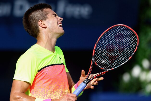 DUBAI, UNITED ARAB EMIRATES - FEBRUARY 26:  Borna Coric of Croatia reacts to a point against Andy Murray of Great Britain during their men's singles quarterfinal match of the ATP Dubai Duty Free Tennis Championships at the Dubai Duty Free Stadium on February 26, 2015 in Dubai, United Arab Emirates.  (Photo by Francois Nel/Getty Images)