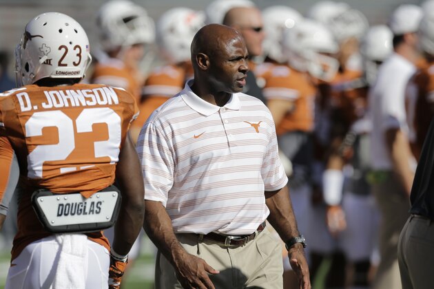 Texas Longhorns head coach Charlie Strong watches his team prior to an NCAA college football game against West Virginia, Saturday, Nov. 8, 2014, in Austin, Texas. (AP Photo/Eric Gay)