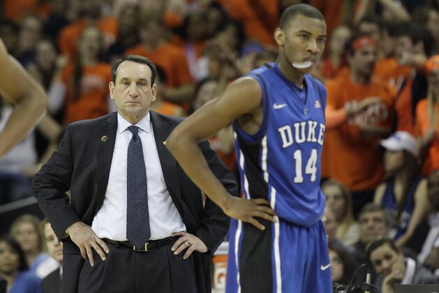 Duke guard Rasheed Sulaimon (14) watches as a Virginia player makes a basket from a technical foul he received as Duke head coach Mike Krzyzewski looks on during the second half of an NCAA college basketball game in Charlottesville, VA., Thursday, Feb. 28, 2013.  Virginia won the game 73-68.  (AP Photo/Steve Helber)