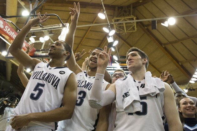 VILLANOVA, PA - FEBRUARY 16: Phil Booth #5, Josh Hart #3, and Ryan Arcidiacono #15 of the Villanova Wildcats sing the team's fight song after the game against the Seton Hall Pirates on February 16, 2015 at the Pavilion in Villanova, Pennsylvania.  The Wildcats defeated the Pirates 80-54 (Photo by Mitchell Leff/Getty Images)