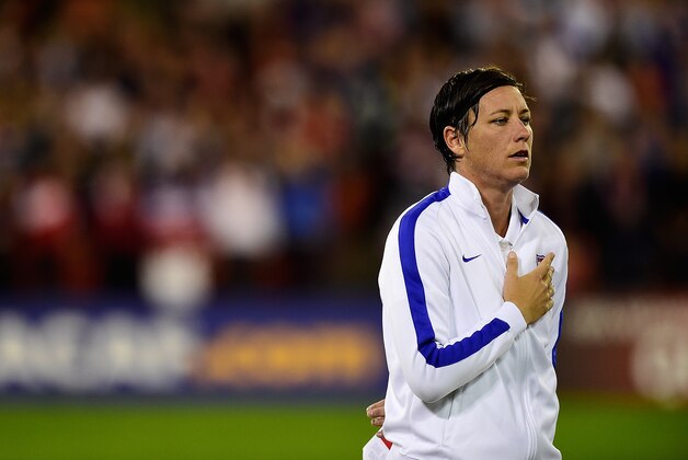 WASHINGTON, DC - OCTOBER 20:  Abby Wambach #20 of the United States stands during the United States National Anthem before playing a game against Haiti during the 2014 CONCACAF Women's Championship at RFK Stadium on October 20, 2014 in Washington, DC.  (Photo by Patrick McDermott/Getty Images)