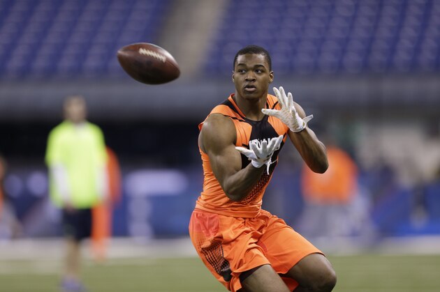 Alabama wide receiver Amari Cooper runs a drill at the NFL football scouting combine in Indianapolis, Saturday, Feb. 21, 2015. (AP Photo/David J. Phillip)