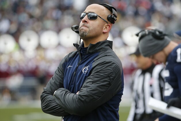 Penn State head coach James Franklin looks at a replay on the scoreboard during the second quarter of an NCAA college football game against Temple in State College, Pa., Saturday, Nov. 15, 2014. (AP Photo/Gene J. Puskar)