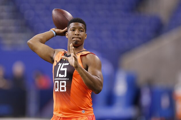 Florida State quarterback Jameis Winston runs a drill at the NFL football scouting combine in Indianapolis, Saturday, Feb. 21, 2015. (AP Photo/Julio Cortez)