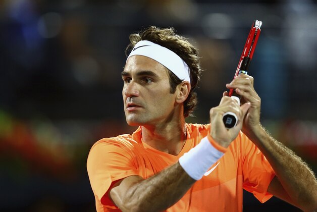 DUBAI, UNITED ARAB EMIRATES - FEBRUARY 26:  Roger Federer of Switzerland in action against Richard Qasquet of France during their men's singles quarterfinal match of the ATP Dubai Duty Free Tennis Championships at the Dubai Duty Free Stadium on February 26, 2015 in Dubai, United Arab Emirates.  (Photo by Francois Nel/Getty Images)