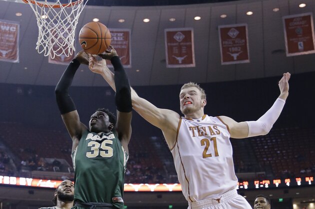 Baylor’s Johnathan Motley (35) tries to shoot as Texas’ Connor Lammert (21) defends during the first half of an NCAA college basketball game, Monday, March 2, 2015, in Austin, Texas. (AP Photo/Eric Gay)