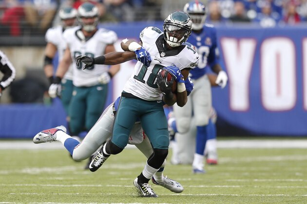 Philadelphia Eagles' Jeremy Maclin (18) is tackled by New York Giants' Dominique Rodgers-Cromartie (21) during the first half of an NFL football game Sunday, Dec. 28, 2014, in East Rutherford, N.J. (AP Photo/Julio Cortez)