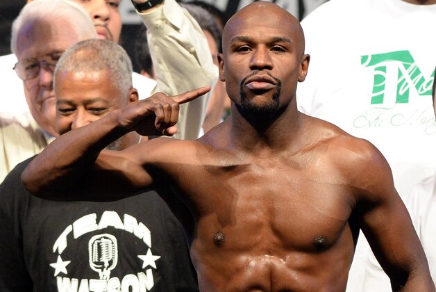 Sep 12, 2014; Las Vegas, NV, USA;  Floyd Mayweather on the scale during the the weigh-in for his WBC Superwelter weight title fight against Marcos Maidana (not pictured) at the MGM Grand Garden Arena. Mandatory Credit: Jayne Kamin-Oncea-USA TODAY Sports