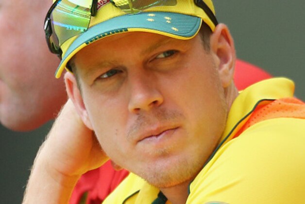 MELBOURNE, AUSTRALIA - FEBRUARY 11:  James Faulkner of Australia looks on from the players bench during the Cricket World Cup warm up match between Australia and the United Arab Emirates at Melbourne Cricket Ground on February 11, 2015 in Melbourne, Australia.  (Photo by Scott Barbour/Getty Images)