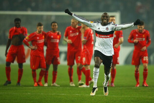 ISTANBUL, TURKEY - FEBRUARY 26:  Liverpool players look dejected as Demba Ba of Besiktas (9) celebrates as Dejan Lovren of Liverpool misses the decisive kick in the penalty shoot out during the UEFA Europa League Round of 32 second leg match between Besiktas JK and Liverpool FC on February 26, 2015 in Istanbul, Turkey.  (Photo by Richard Heathcote/Getty Images)