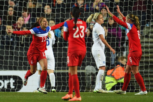 MILTON KEYNES, ENGLAND - FEBRUARY 13:  Alex Morgan of the United States (13) celebrates as she scores their first goal during the Women's Friendly International match between England and USA at Stadium mk on February 13, 2015 in Milton Keynes, England.  (Photo by Tom Dulat/Getty Images)