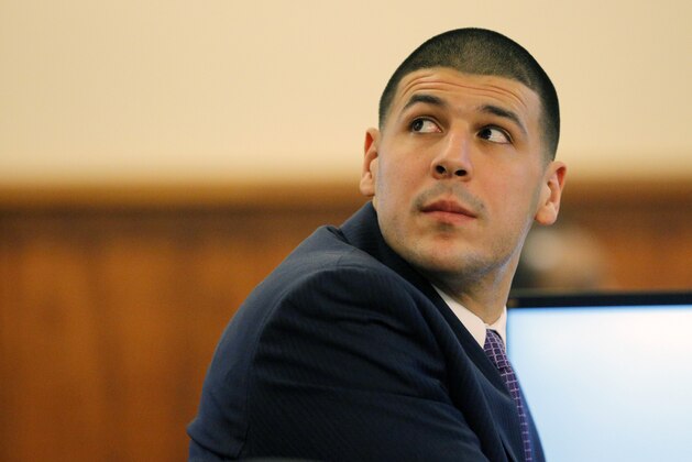 Former New England Patriots NFL football player Aaron Hernandez listens to testimony during his murder trial at Bristol County Superior Court, Tuesday, Feb. 24, 2015, in Fall River, Mass. Hernandez is charged in the murder of Odin Lloyd in 2013. (AP Photo/Brian Snyder, Pool)