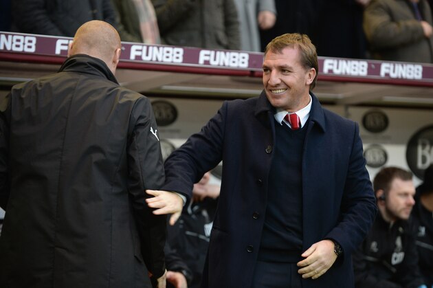 BURNLEY, ENGLAND - DECEMBER 26:  Brendan Rodgers, Manager of Liverpool  with Sean Dyche, Manager of Burnley during the Barclays Premier League match between Burnley and Liverpool at Turf Moor on December 26, 2014 in Burnley, England.  (Photo by Tony Marshall/Getty Images)