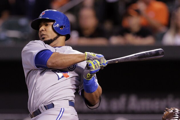 Toronto Blue Jays' Edwin Encarnacion doubles in the first inning of a baseball game against the Baltimore Orioles, Tuesday, Sept. 16, 2014, in Baltimore. Jose Bautista scored on the play. (AP Photo/Patrick Semansky)