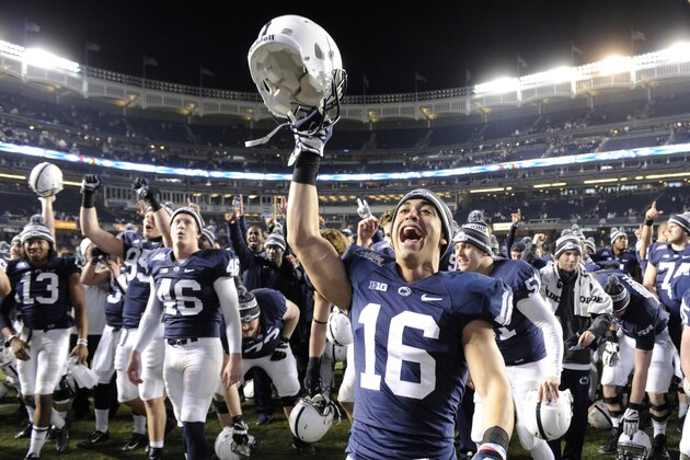 Penn State cornerback Devin Pryor (16) celebrates with teammates after Penn State defeated Boston College, 31-30, in overtime of the Pinstripe Bowl NCAA college football game Saturday, Dec. 27, 2014, at Yankee Stadium in New York. (AP Photo/Bill Kostroun)
