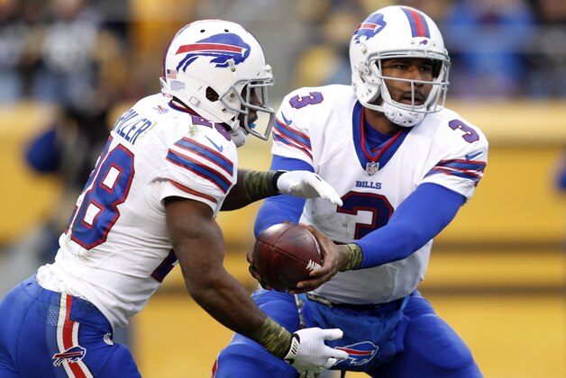 Nov 10, 2013; Pittsburgh, PA, USA; Buffalo Bills running back C.J. Spiller (28) takes a hand-off from quarterback EJ Manuel (3) against the Pittsburgh Steelers during the third quarter at Heinz Field. The Pittsburgh Steelers won 23-10. Mandatory Credit: Charles LeClaire-USA TODAY Sports