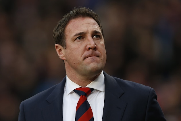 Cardiff City's manager Malky Mackay arrives at the dugout before the start of their English Premier League soccer match against Crystal Palace at Selhurst Park, London, Saturday, Dec. 7, 2013. (AP Photo/Sang Tan) Cardiff City's manager Malky Mackay arrives at the dugout before the start of their English Premier League soccer match against Crystal Palace at Selhurst Park, London, Saturday, Dec. 7, 2013. (AP Photo/Sang Tan)
