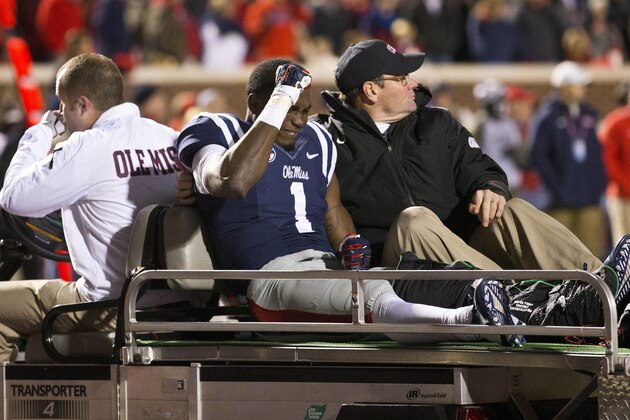 FILE - In this Nov. 1, 2014, file photo, Mississippi wide receiver Laquon Treadwell (1) reacts as he is taken off the field after being injured duirng an NCAA college football game in Oxford, Miss. Treadwell will miss the remainder of the season after breaking his left fibula and dislocating an ankle last week in a 35-31 loss to Auburn. (AP Photo/Brynn Anderson, File)