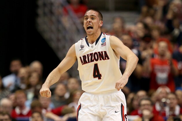 ANAHEIM, CA - MARCH 29:  T.J. McConnell #4 of the Arizona Wildcats celebrates in the second half while taking on the Wisconsin Badgers during the West Regional Final of the 2014 NCAA Men's Basketball Tournament at the Honda Center on March 29, 2014 in Anaheim, California.  (Photo by Jeff Gross/Getty Images)