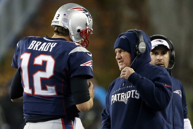 New England Patriots quarterback Tom Brady (12) confers with head coach Bill Belichick, as offensive coordinator Josh McDaniels looks on, at far right, in the first half of an NFL football game against the Denver Broncos on Sunday, Nov. 2, 2014, in Foxborough, Mass. (AP Photo/Elise Amendola)