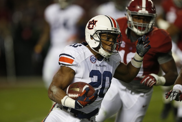 Auburn running back Corey Grant (20) runs against Alabama during the first half of the Iron Bowl NCAA college football game, Saturday, Nov. 29, 2014, in Tuscaloosa, Ala. (AP Photo/Butch Dill)