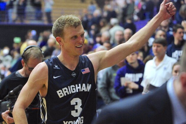 BYU's Tyler Haws gives a thumbs-up to fans as he leaves the court at the end of an NCAA college basketball game against Portland in Portland, Ore., Thursday, Feb. 26, 2015. Haws scored 21 points in passing Jimmer Fredette as BYU's all-time leading scorer and leading the Cougars to an 82-69 victory. Haws now has 2.614 points. (AP Photo/Greg Wahl-Stephens)