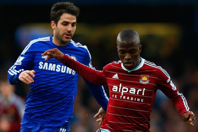 LONDON, ENGLAND - DECEMBER 26:  Cesc Fabregas of Chelsea marshalls Enner Valencia of West Ham during the Barclays Premier League match between Chelsea and West Ham United at Stamford Bridge on December 26, 2014 in London, England.  (Photo by Clive Rose/Getty Images)