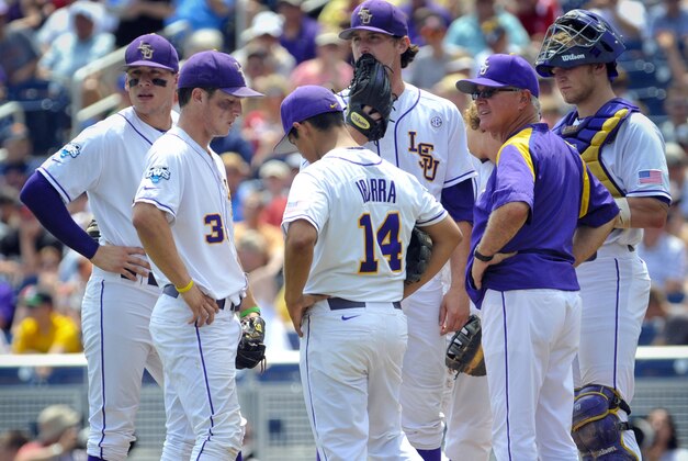 Jun 18, 2013; Omaha, NE, USA; LSU Tigers head coach Paul Mainieri makes a pitching change during their College World Series game against the North Carolina Tar Heels at TD Ameritrade Park. Mandatory Credit: Dave Weaver-USA Today Sports